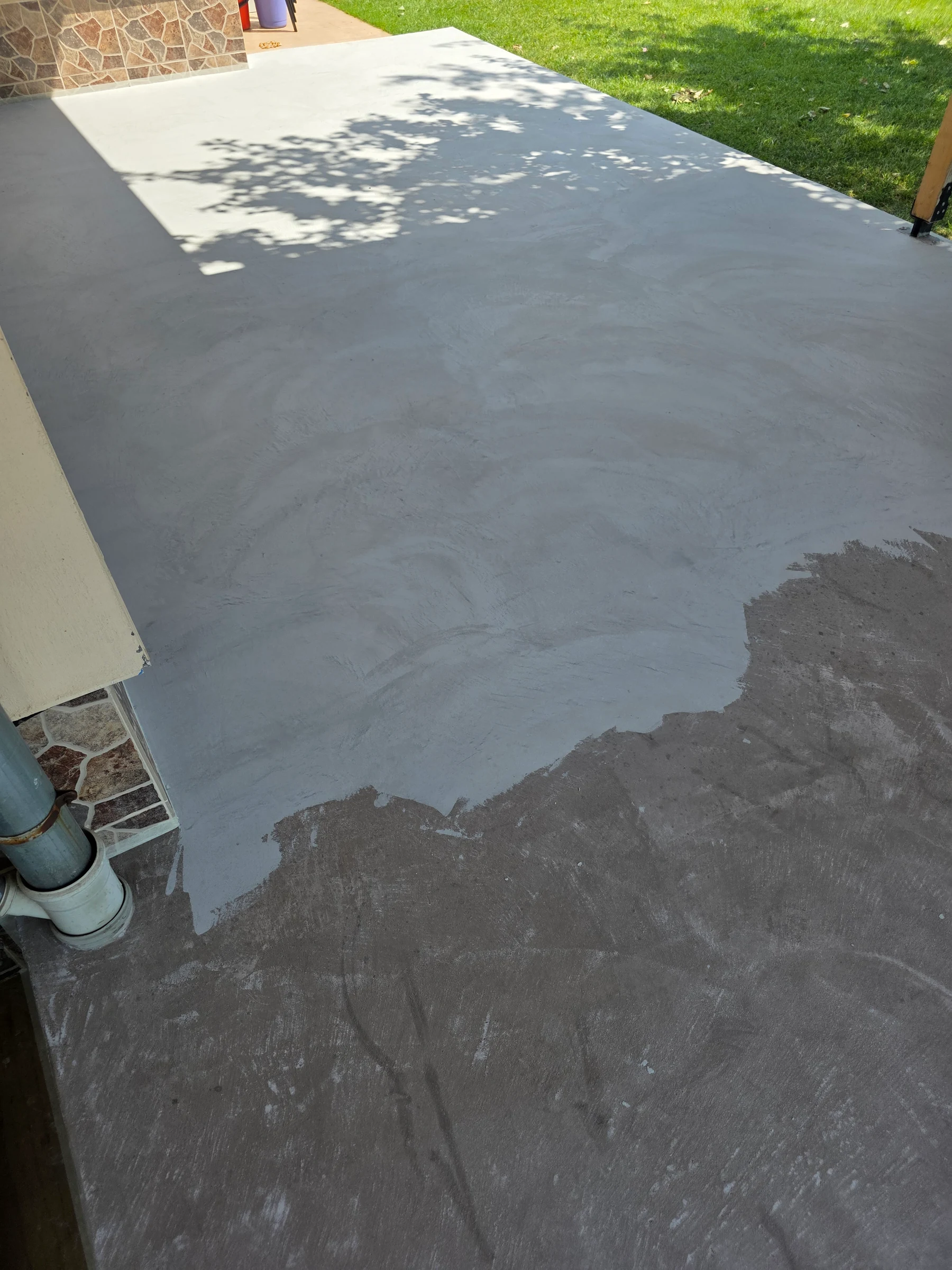 Work in progress while applying the new finish to the veranda floor.